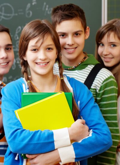 Portrait of happy teens looking at camera with smiles